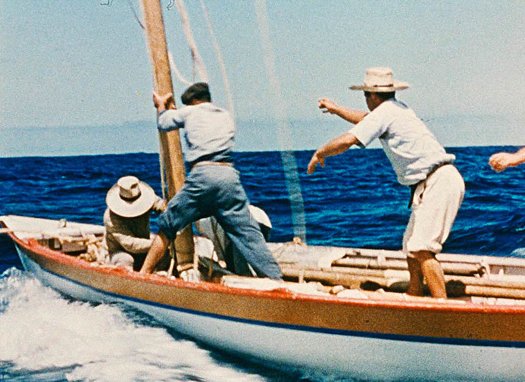 Trois hommes sur un bateau